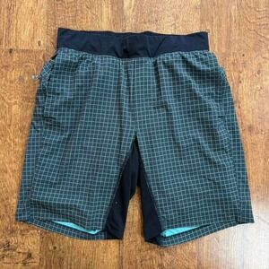 Lululemon lined black and teal grid pattern design workout shorts. size medium.